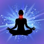 Silhouette of a person meditating in lotus position with a glowing throat chakra and radiant blue-purple energy background.