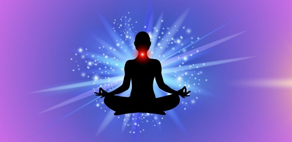 Silhouette of a person meditating in lotus position with a glowing throat chakra and radiant blue-purple energy background.